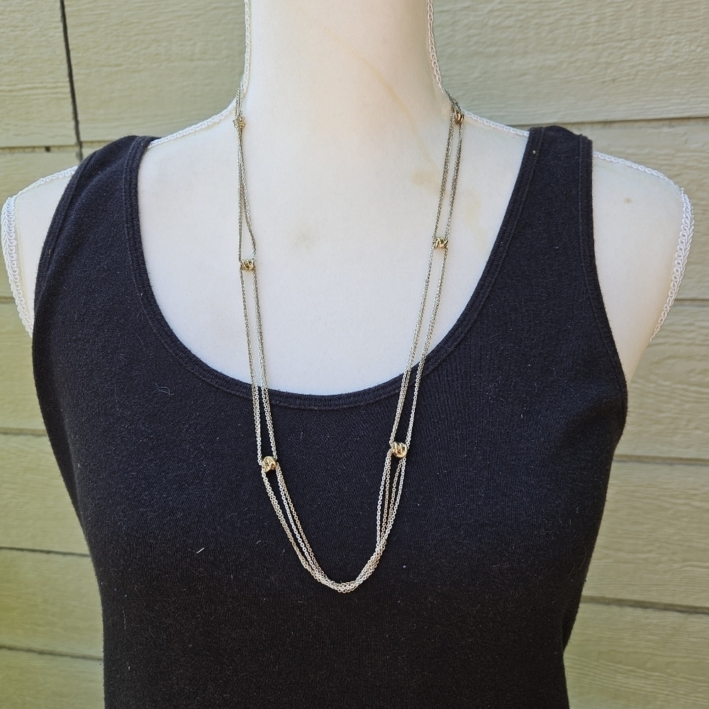 silver and gold tone chain necklace with gold tone stations
